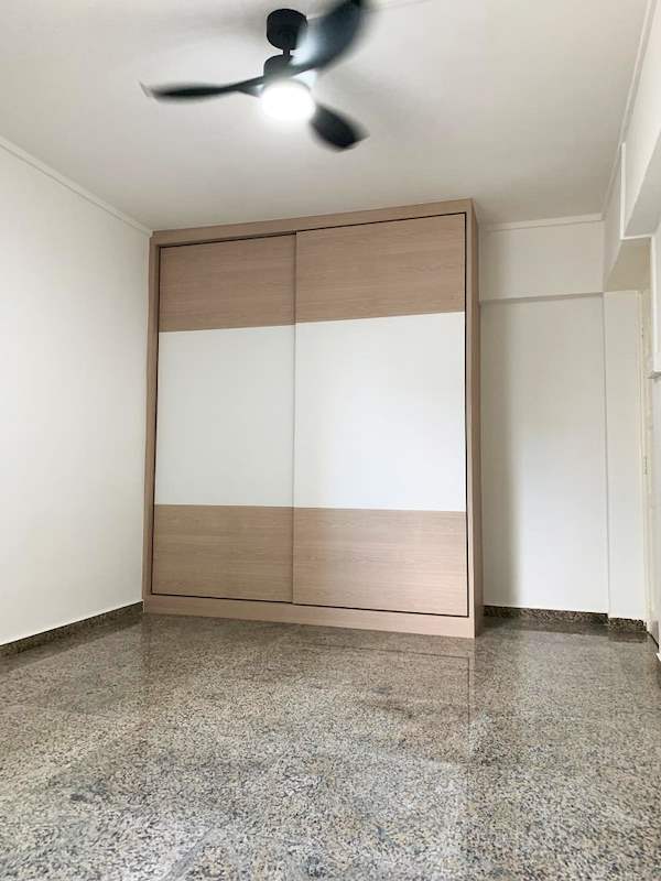 Bedroom with a sliding-door wardrobe and a black ceiling fan light - HDB resale flat renovation with polished terrazzo floors, new kitchen and bathrooms (C04) | Larry Contractors, HDB Licensed Renovation Contractor, Singapore
