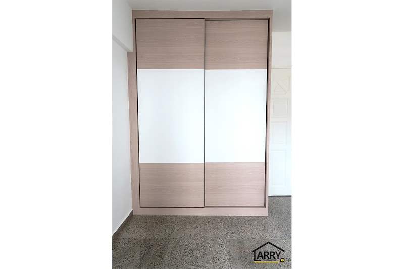 Sliding-door wardrobe in light wood and white laminate with the doors closed - HDB resale flat renovation with polished terrazzo floors, new kitchen and bathrooms (C04) | Larry Contractors, HDB Licensed Renovation Contractor, Singapore