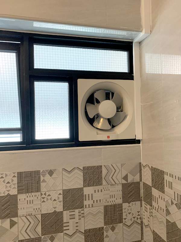 Window with black frames and an exhaust fan above a patterned tile band - HDB resale flat renovation with polished terrazzo floors, new kitchen and bathrooms (C04) | Larry Contractors, HDB Licensed Renovation Contractor, Singapore
