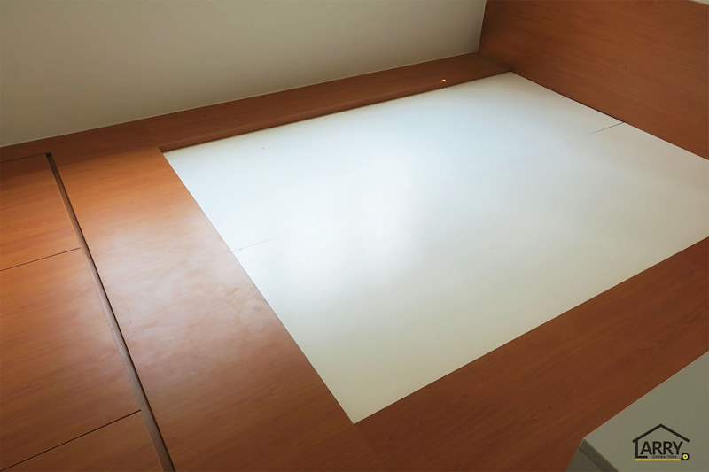 Timber-laminate bedroom platform with a white mattress recess in the centre - HDB flat renovation with a platform bay window seat and blue kitchen (C20) | Larry Contractors, HDB Licensed Renovation Contractor, Singapore