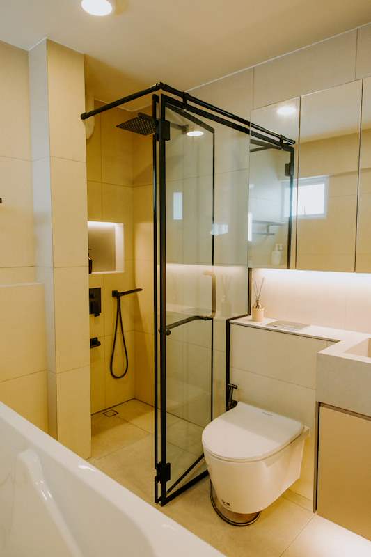 Bathroom with a black-framed shower enclosure, rain shower and wall-hung toilet - Full HDB maisonette renovation with a curved timber-slat island and lit staircase (140BB) | Larry Contractors, HDB Licensed Renovation Contractor, Singapore