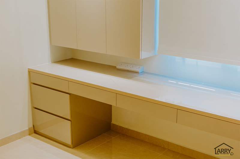 Built-in desk with drawers and overhead cabinets in cream laminate, roller blind behind - HDB flat renovation in cream and mirror-trim laminate with a galley kitchen (C10) | Larry Contractors, HDB Licensed Renovation Contractor, Singapore