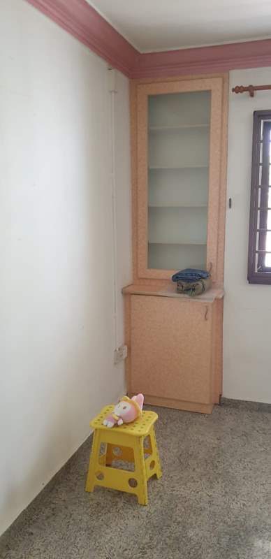 Before: an old bedroom with a pink cornice, a built-in display cabinet and a terrazzo floor - HDB resale flat renovation with polished terrazzo floors, new kitchen and bathrooms (C04) | Larry Contractors, HDB Licensed Renovation Contractor, Singapore