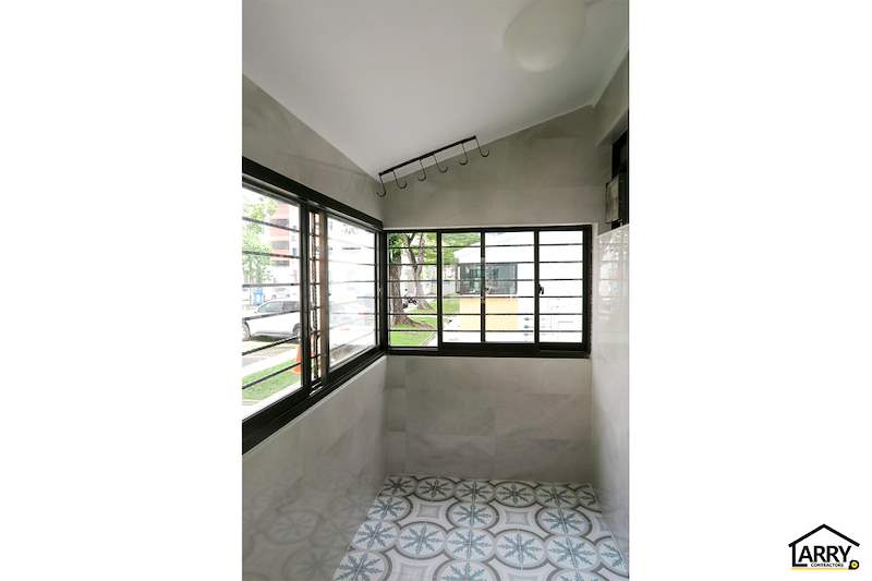 Service yard corner windows with black frames, hooks on the wall and patterned floor tiles - HDB resale flat renovation with polished terrazzo floors, new kitchen and bathrooms (C04) | Larry Contractors, HDB Licensed Renovation Contractor, Singapore