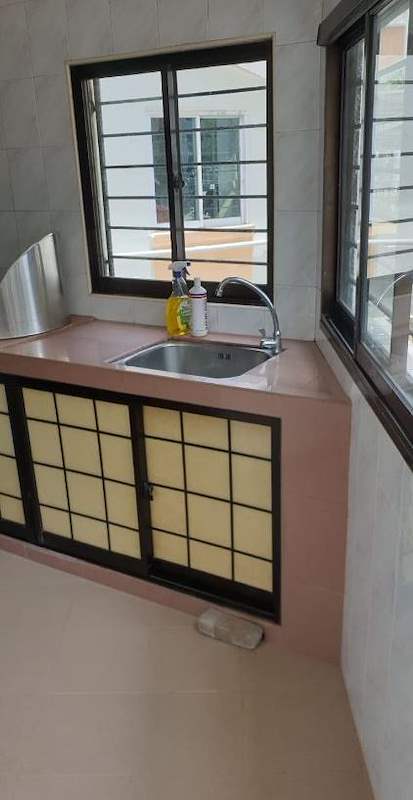 Before: the old kitchen with a pink tiled counter and lattice-front cabinet doors - HDB resale flat renovation with polished terrazzo floors, new kitchen and bathrooms (C04) | Larry Contractors, HDB Licensed Renovation Contractor, Singapore