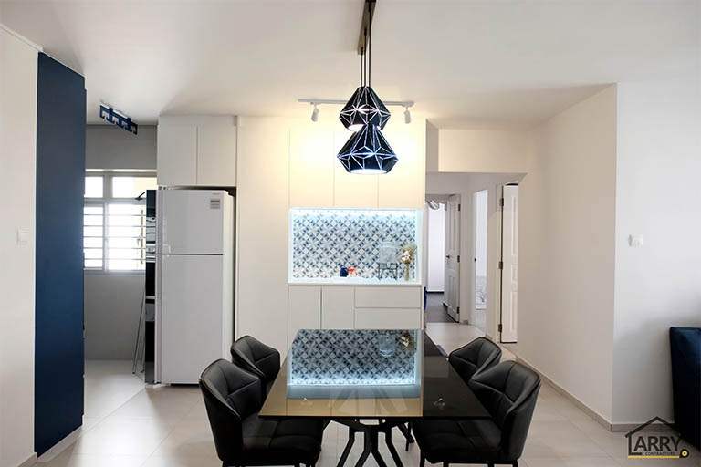 Dining area with a glass table, black chairs, a geometric pendant light and a backlit display cabinet - HDB flat renovation with a blue kitchen and a glass-walled walk-in wardrobe (C18) | Larry Contractors, HDB Licensed Renovation Contractor, Singapore