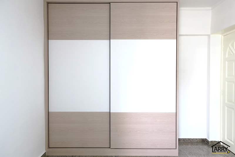 Light wood and white sliding-door wardrobe with the doors closed - HDB resale flat renovation with polished terrazzo floors, new kitchen and bathrooms (C04) | Larry Contractors, HDB Licensed Renovation Contractor, Singapore