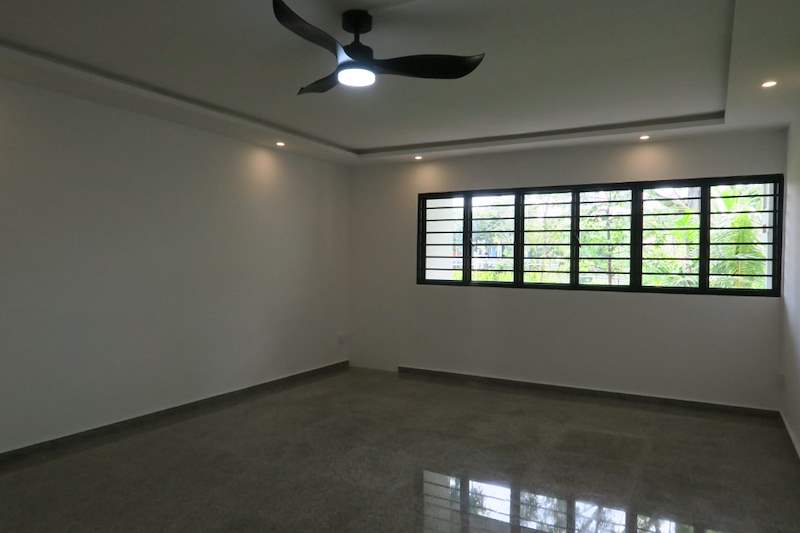 Living room with a black fan light, cove ceiling and a grilled window - HDB resale flat renovation with polished terrazzo floors, new kitchen and bathrooms (C04) | Larry Contractors, HDB Licensed Renovation Contractor, Singapore
