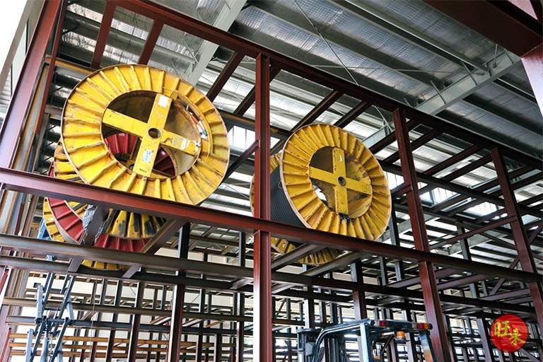 Cable drums on the upper tier of the primer-painted steel frame before the blue top coat - Heavy-duty cable drum racking in a cable yard (TSE) | Larry Contractors, HDB Licensed Renovation Contractor, Singapore
