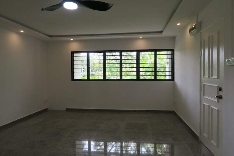 Living room with a grilled window and white panelled door, polished terrazzo floor - HDB resale flat renovation with polished terrazzo floors, new kitchen and bathrooms (C04) | Larry Contractors, HDB Licensed Renovation Contractor, Singapore