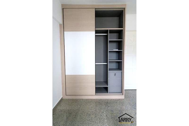 Sliding-door wardrobe opened to show grey shelving, a hanging rail and drawers - HDB resale flat renovation with polished terrazzo floors, new kitchen and bathrooms (C04) | Larry Contractors, HDB Licensed Renovation Contractor, Singapore