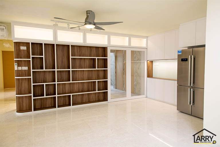 Living area with the open shelving partition, ceiling fan and kitchen entrance - HDB flat renovation with full-height carpentry and a wood-tone kitchen (C12) | Larry Contractors, HDB Licensed Renovation Contractor, Singapore