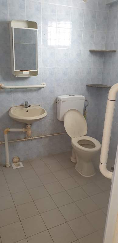 Before: the old bathroom with blue tiles, a mirror cabinet and toilet - HDB resale flat renovation with polished terrazzo floors, new kitchen and bathrooms (C04) | Larry Contractors, HDB Licensed Renovation Contractor, Singapore