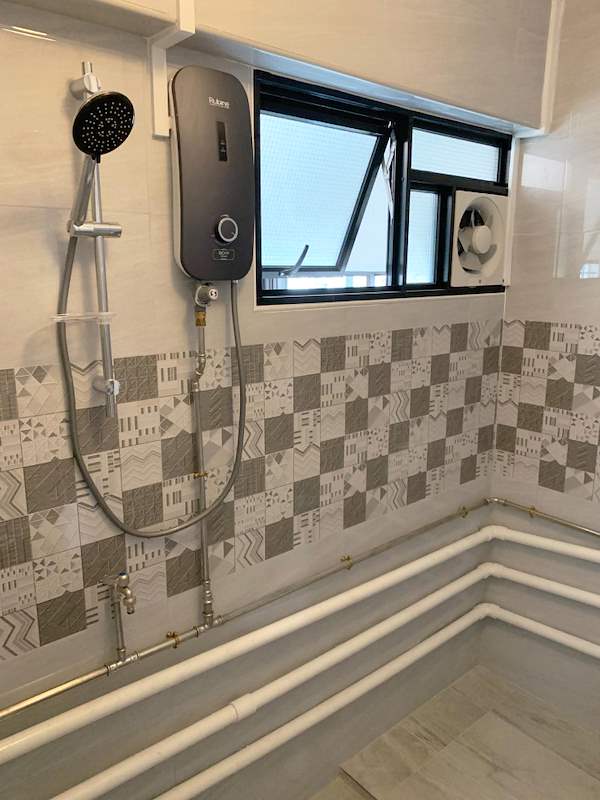 Shower with an instant water heater, patterned tile band and a window with an exhaust fan - HDB resale flat renovation with polished terrazzo floors, new kitchen and bathrooms (C04) | Larry Contractors, HDB Licensed Renovation Contractor, Singapore