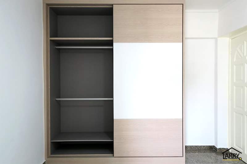 Sliding-door wardrobe opened to the hanging rail section - HDB resale flat renovation with polished terrazzo floors, new kitchen and bathrooms (C04) | Larry Contractors, HDB Licensed Renovation Contractor, Singapore