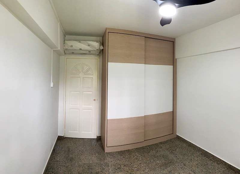 Bedroom with a light wood and white sliding-door wardrobe, ceiling fan and a white panelled door - HDB resale flat renovation with polished terrazzo floors, new kitchen and bathrooms (C04) | Larry Contractors, HDB Licensed Renovation Contractor, Singapore