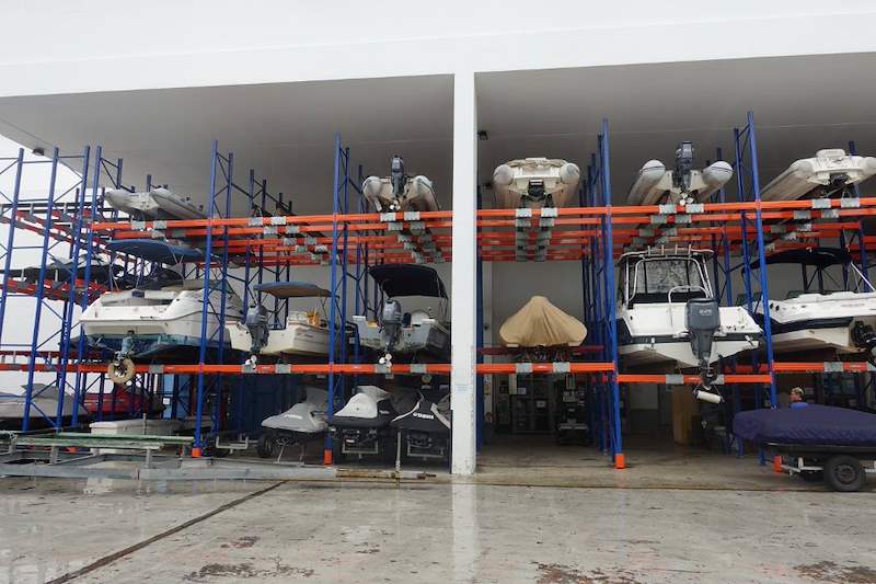 Wide view of the boat storage racks between the shed columns, small boats stored two tiers high - Heavy-duty storage racking for boats and jet skis (Sentosa) | Larry Contractors, HDB Licensed Renovation Contractor, Singapore