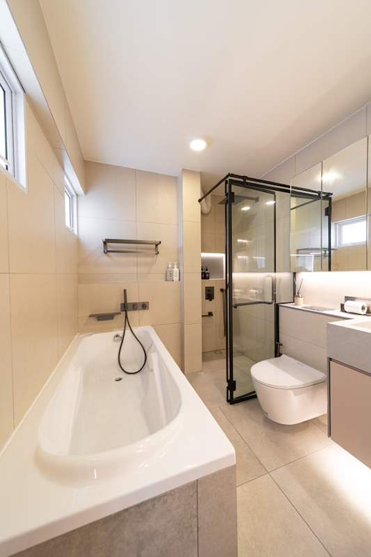 Bathroom with a built-in tub, black-framed shower enclosure and vanity, window above - Full HDB maisonette renovation with a curved timber-slat island and lit staircase (140BB) | Larry Contractors, HDB Licensed Renovation Contractor, Singapore