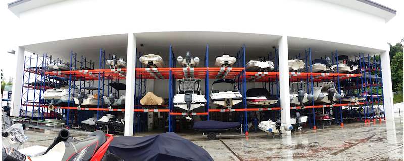 Panoramic view of the boat racks filling the open-sided shed, boats stored two tiers high - Heavy-duty storage racking for boats and jet skis (Sentosa) | Larry Contractors, HDB Licensed Renovation Contractor, Singapore