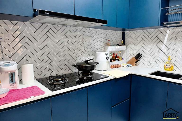 Navy blue kitchen cabinets with a white worktop, cooker hood and white herringbone tile splashback - HDB flat renovation with a blue kitchen and a glass-walled walk-in wardrobe (C18) | Larry Contractors, HDB Licensed Renovation Contractor, Singapore