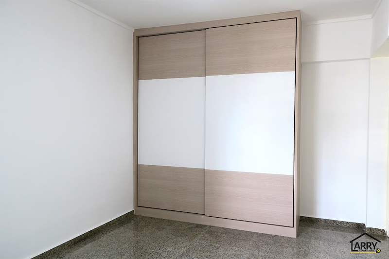 Light wood and white sliding-door wardrobe in a bedroom with a terrazzo floor - HDB resale flat renovation with polished terrazzo floors, new kitchen and bathrooms (C04) | Larry Contractors, HDB Licensed Renovation Contractor, Singapore