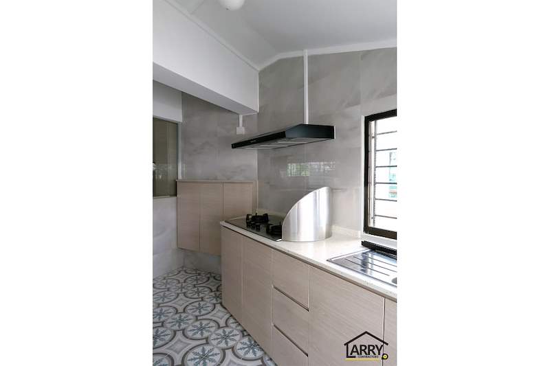 Kitchen with a black cooker hood, light wood cabinets and a window - HDB resale flat renovation with polished terrazzo floors, new kitchen and bathrooms (C04) | Larry Contractors, HDB Licensed Renovation Contractor, Singapore
