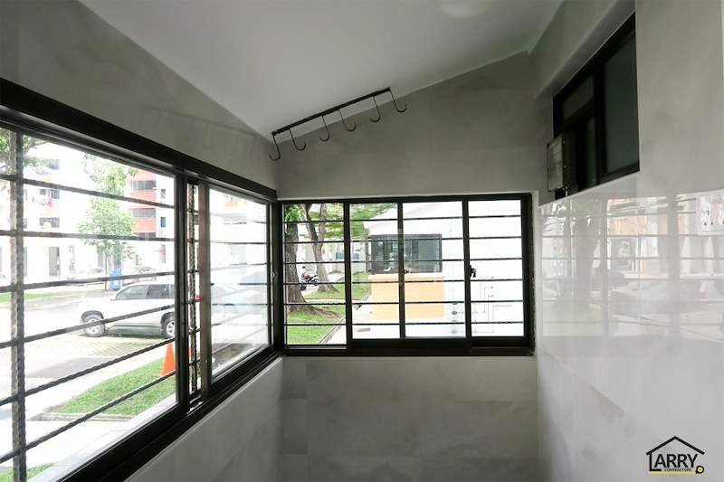 Corner windows with black frames looking out to the trees, hooks fixed on the wall - HDB resale flat renovation with polished terrazzo floors, new kitchen and bathrooms (C04) | Larry Contractors, HDB Licensed Renovation Contractor, Singapore