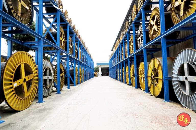 After: the outdoor racking rows loaded with cable drums, looking down the central aisle - Heavy-duty cable drum racking in a cable yard (TSE) | Larry Contractors, HDB Licensed Renovation Contractor, Singapore