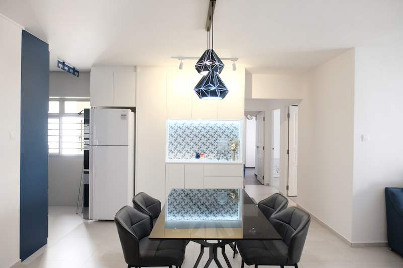 Dining area with a glass table, black chairs, a geometric pendant light and a backlit patterned-tile display niche - HDB flat renovation with a navy kitchen and a glass-walled walk-in wardrobe (407B) | Larry Contractors, HDB Licensed Renovation Contractor, Singapore