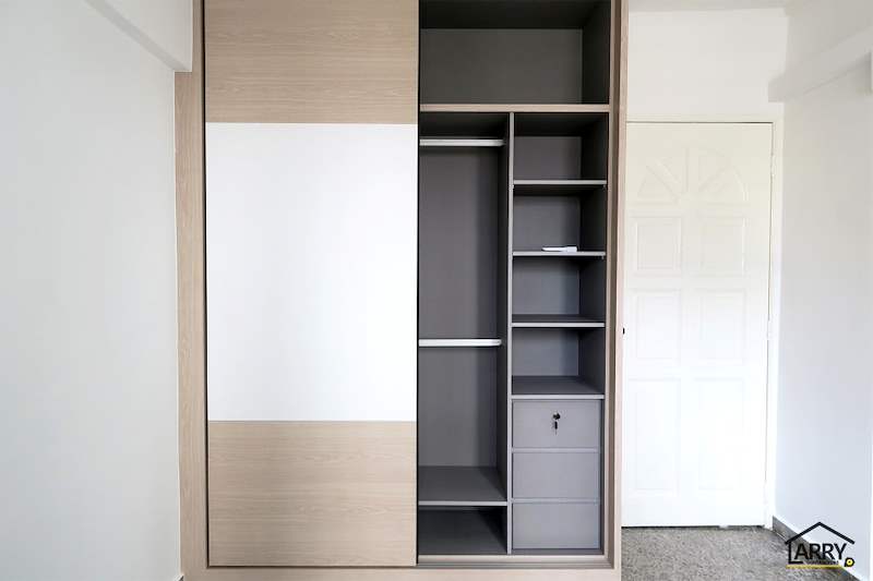 Sliding-door wardrobe opened to show the grey shelving and lockable drawers - HDB resale flat renovation with polished terrazzo floors, new kitchen and bathrooms (C04) | Larry Contractors, HDB Licensed Renovation Contractor, Singapore