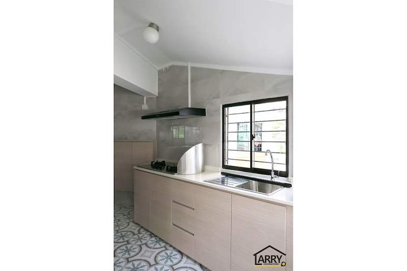 Kitchen with a gas hob, stainless sink, cooker hood and a grilled window - HDB resale flat renovation with polished terrazzo floors, new kitchen and bathrooms (C04) | Larry Contractors, HDB Licensed Renovation Contractor, Singapore