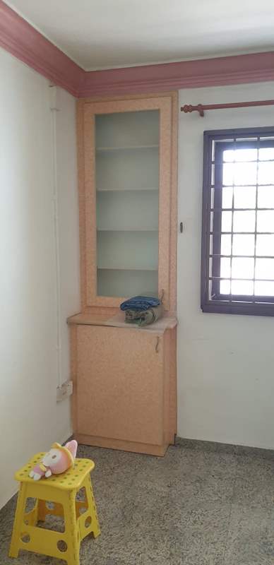 Before: an old bedroom with a pink cornice, a built-in display cabinet and a terrazzo floor - HDB resale flat renovation with polished terrazzo floors, new kitchen and bathrooms (C04) | Larry Contractors, HDB Licensed Renovation Contractor, Singapore