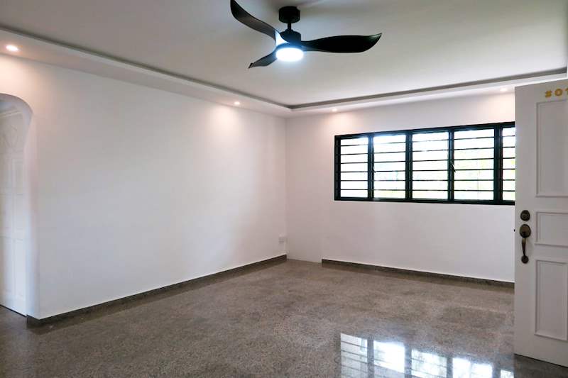Living room after renovation with a cove ceiling, fan light, window grilles and white entrance door - HDB resale flat renovation with polished terrazzo floors, new kitchen and bathrooms (C04) | Larry Contractors, HDB Licensed Renovation Contractor, Singapore